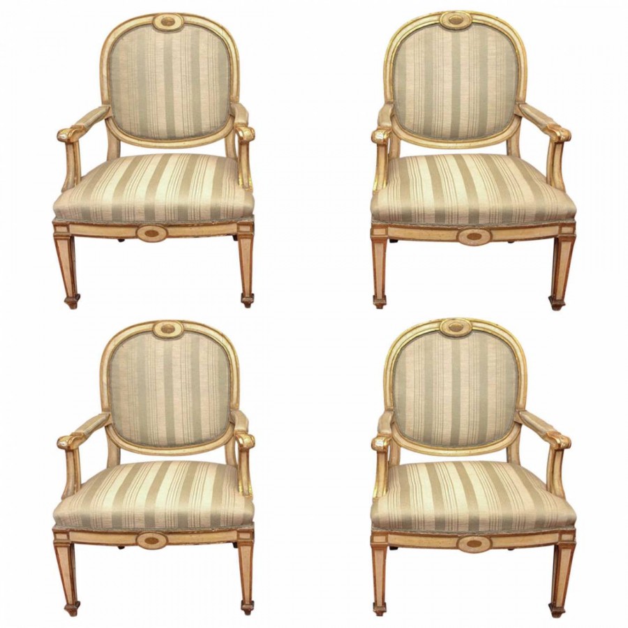 Four Italian Louis XVI Parcel Gilt and Painted Armchairs