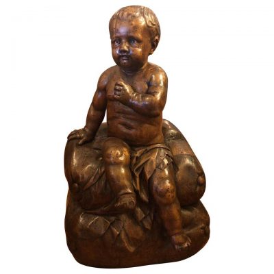 Italian Carved Walnut Baby on Cushion